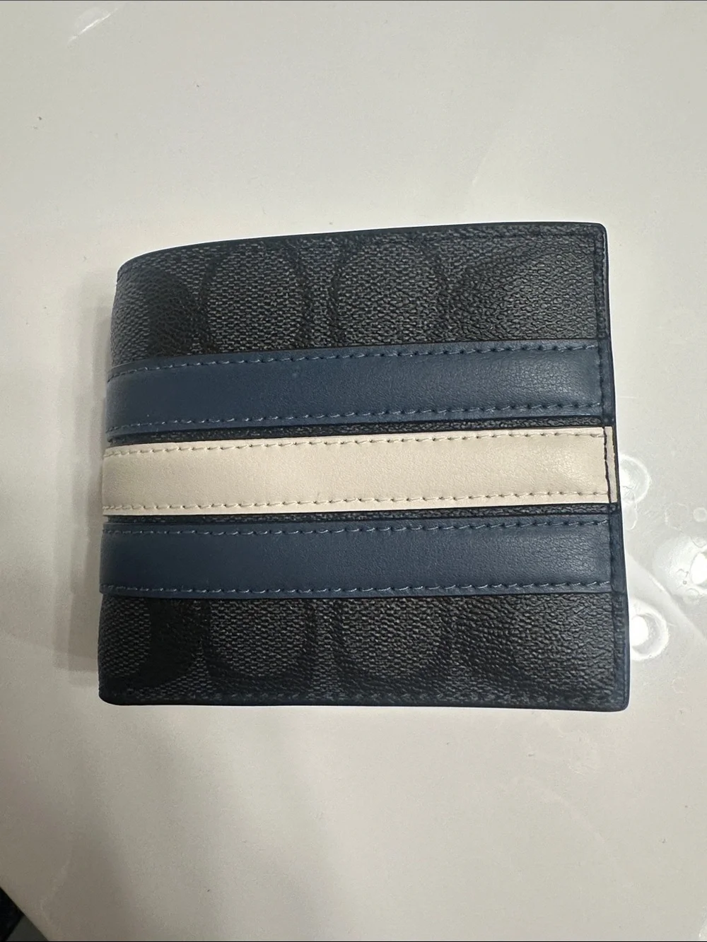 Coach Men's Black Signature Pattern Bifold Wallet with Blue and Cream Stripes